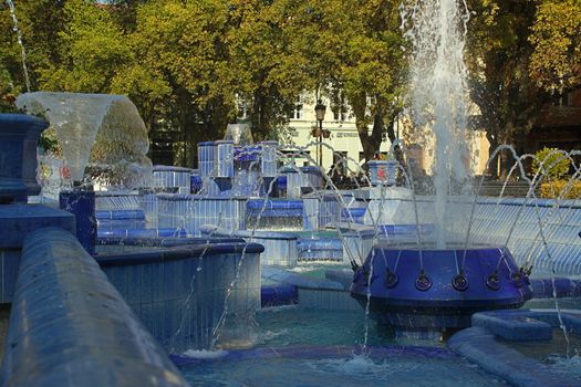 Fountain made of blue marble with water splashing around