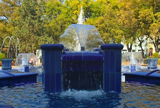 Fountain made of blue marble with water splashing around