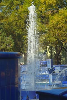 Fountain made of blue marble with water splashing around