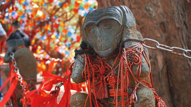 Hear no evil monkey statue in Hainan monkey forest, China