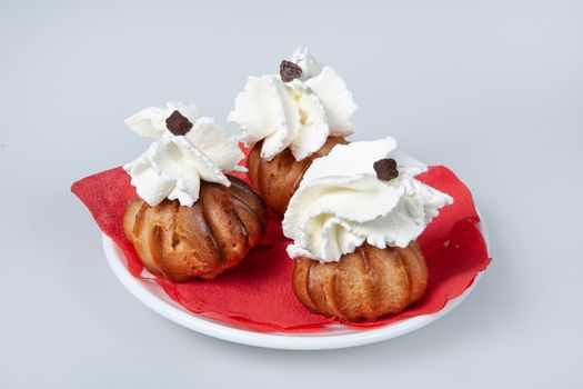 Icecream with different ingredients on a studio neutral background
