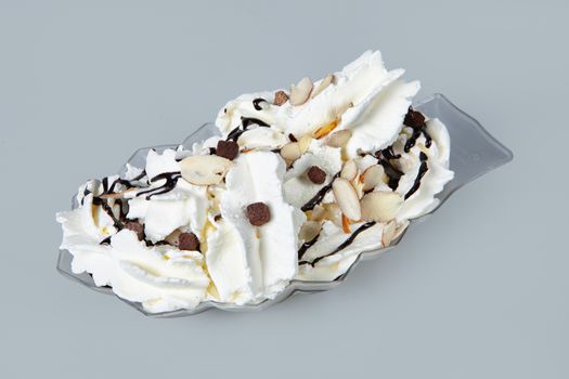 Icecream with different ingredients on a studio neutral background