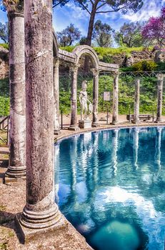 Greek statue of Ares overlooking the ancient pool called Canopus, inside Villa Adriana (Hadrian's Villa), Tivoli, Italy
