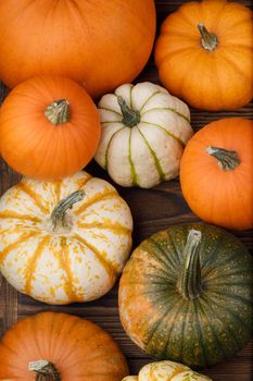 Many orange pumpkins on wooden background , Halloween concept