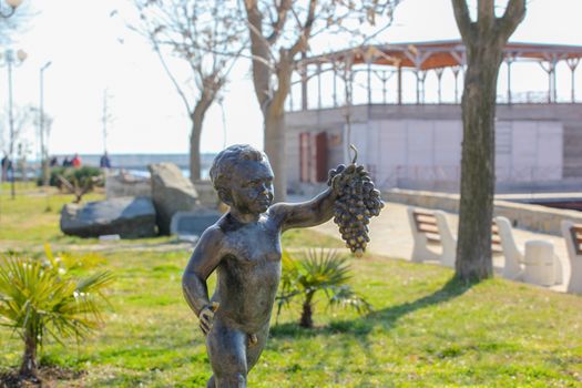 Pomorie, Bulgaria - March 02, 2019: "The Boy with Grapes" - The Statue Symbol Of The Town Of Pomorie.