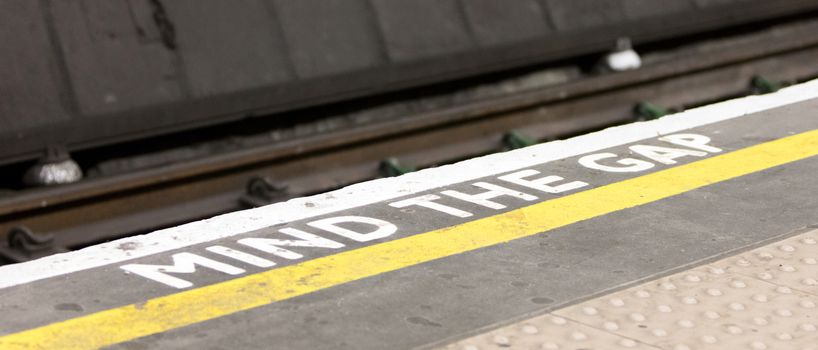 Mind the gap, warning in the London underground, selective focus