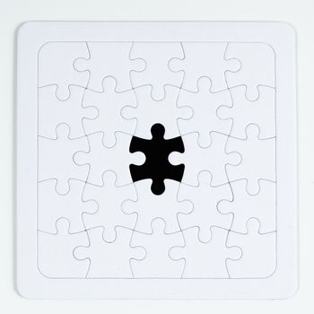 a piece of the different color in a puzzle