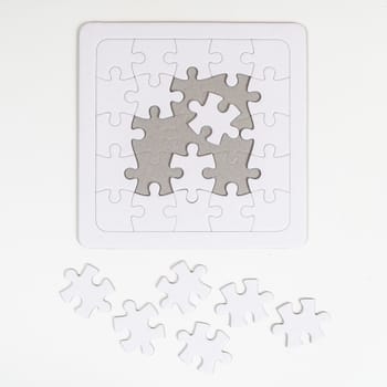 the incomplete white puzzle 