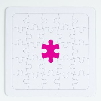 a piece of the different color in a puzzle