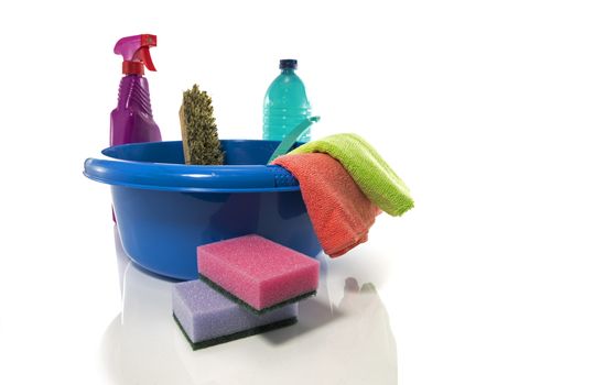 blue washing up dish with cleaning tools and detergents as degreaser and a brush with wipes insulated on white background