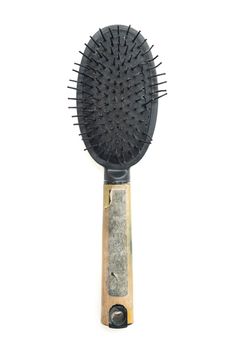 Top view used old dirty hair brush isolated on white background.