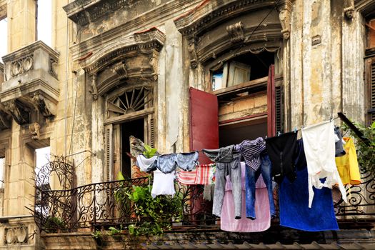 Hanging laundry to dry on balcony in Havana, Cuba