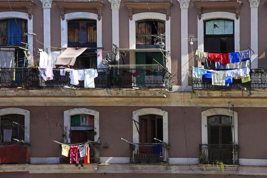 Hanging laundry to dry on balcony in Havana, Cuba