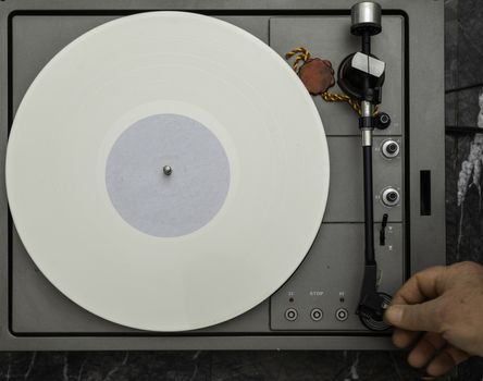 Vintage vinyl turntable with vinyl plate. Listen to music. Top view.