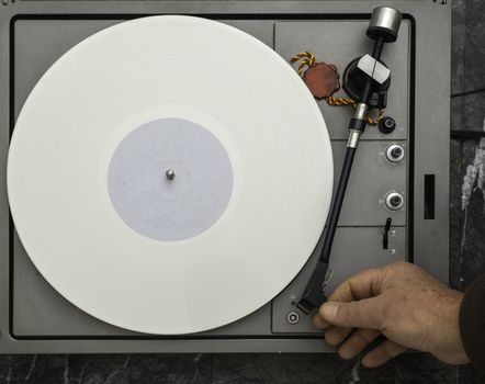 Vintage vinyl turntable with vinyl plate. Listen to music. Top view.