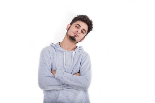 Portrait of casual young man standing isolated on white background