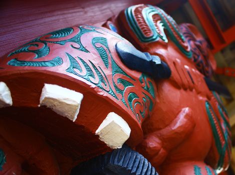 Maori wooden carving with penis. Fertility symbol