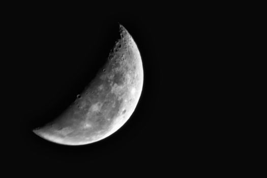The crescent Moon shot through a telescope using the prime focus technique.