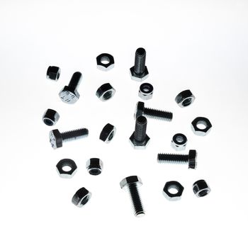 some lock nuts and bolts of various sizes on a white background