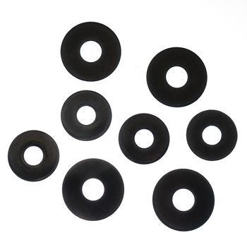 some washers of various sizes on a white background