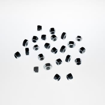 some lock nuts of various sizes on a white background