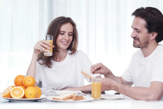 Couple having breakfast together at home 