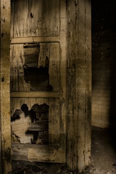 Detail of a wooden door of an abandoned building.