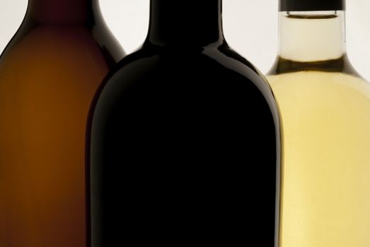 Three bottles of wine, white background, red wine and white wine