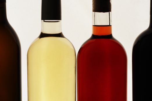 Four bottles of wine, white background, red wine, white wine, rose wine