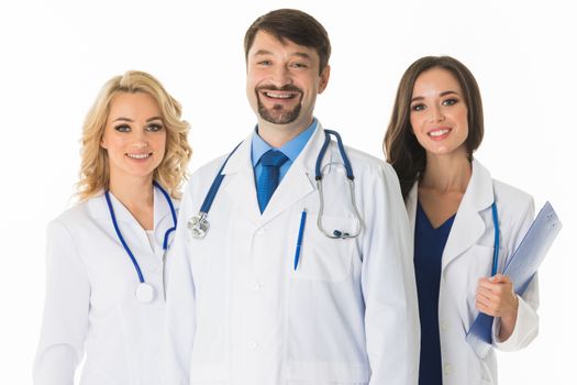 Successful team of medical doctors are looking at camera and smiling , studio isolated on white background