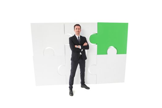 Business man and ready puzzle of giant pieces . Strategy and problem solution concept