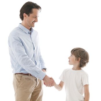 Cheerful father and son shaking hands isolated on white background family unity concept