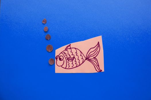 Funny fish with bubbles on blue background, fool's Day.