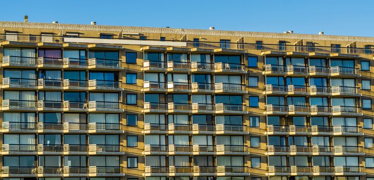 many apartments in a big city building, balconies with windows, belgian architecture