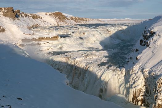 Panoramic image of the frozen waterfall Gullfoss, Iceland, Europe