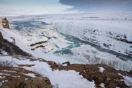 Panoramic image of the frozen waterfall Gullfoss, Iceland, Europe