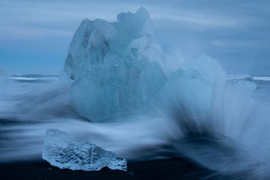 Iceberg on a stormy beach, Jökulsarlon, Iceland