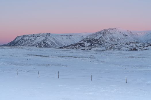 Sunrise over snow-covered mountains, Iceland, Europe