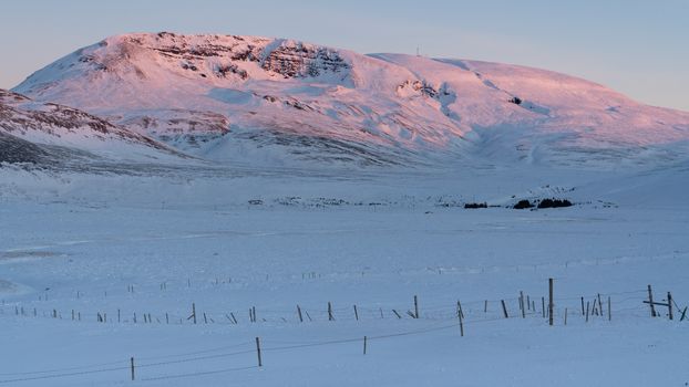 Sunrise over snow-covered mountains, Iceland, Europe