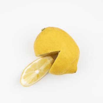 A lemon cut on a white surface