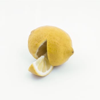 A lemon cut on a white surface