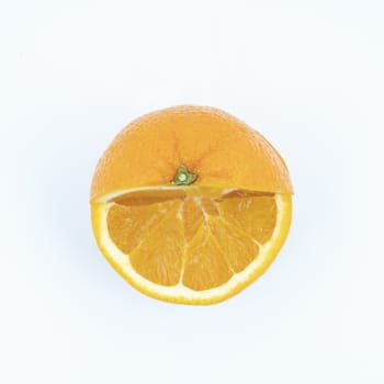 an orange cut on a white surface