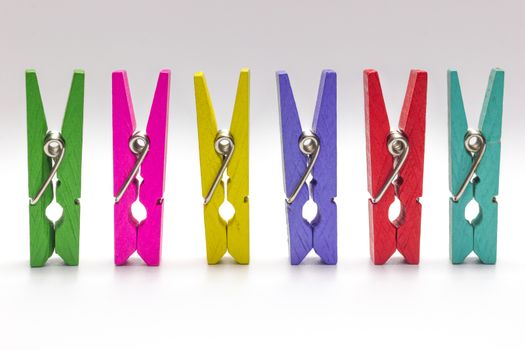 Colorful clothespin. Multicolor Wooden clip set on white background.