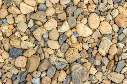 Small beautiful colorful pebbles, Multicolored little rocky background.