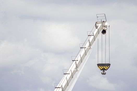 White lifting crane with black lifting hoop