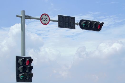 Traffic light and signboard limit of height on blue sky background