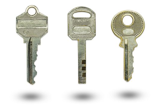 Three different keys on a white background. The concept of confidentiality or security of sensitive information.