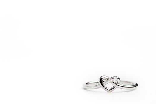 Heart shaped ring placed on a white background. The concept of love or marriage. Copy space can be used to write articles about Valentine's Day.