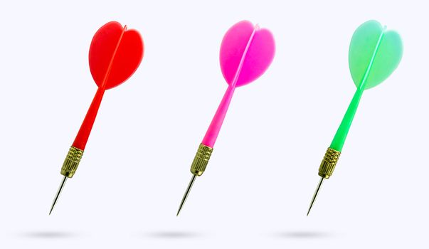 Closeup set of multicolor sharp darts on white background. Ideal for use in articles aimed at targeting business goals.