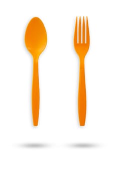 Orange plastic fork and spoon on isolate white background with clipping path.
